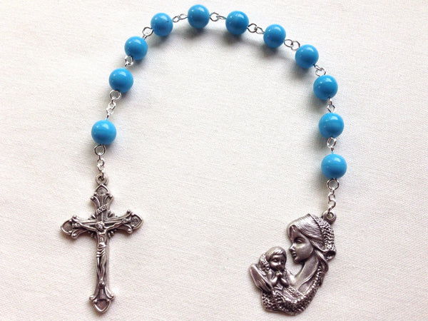 Blue pocket rosary with mother and child medal