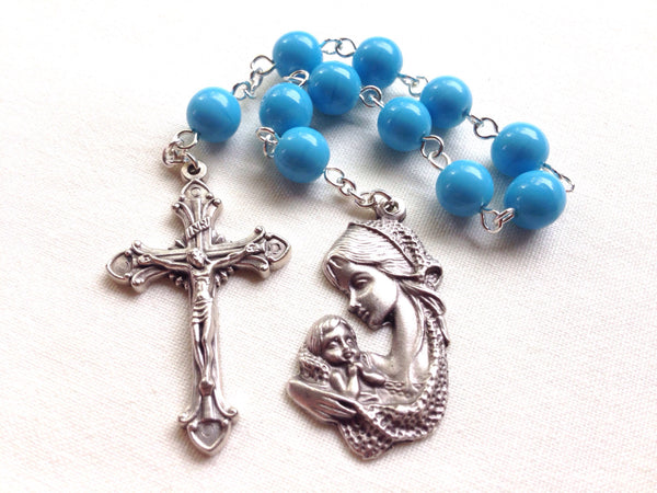 Blue pocket rosary with mother and child medal