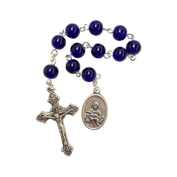 Blue rosary with silver cross and medal on a white background