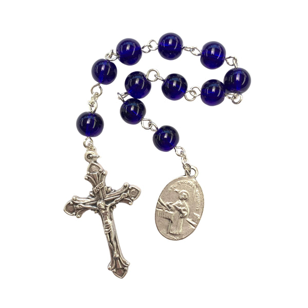 Blue rosary with silver cross and medal on a white background